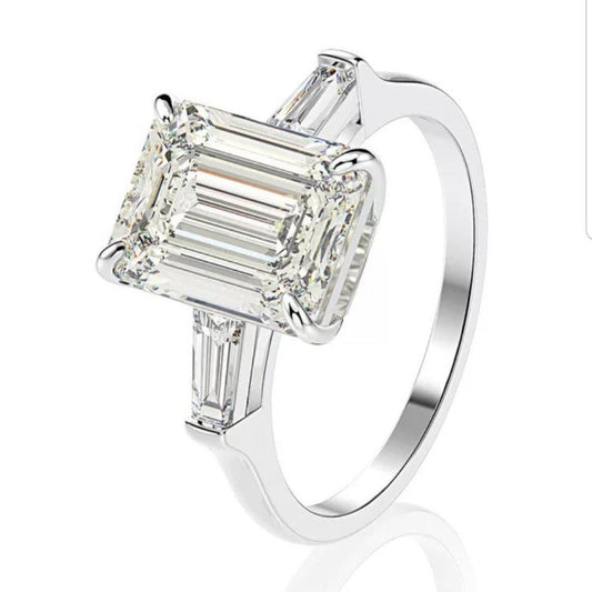 Brilliant Emerald Cut Cubic Zirconia Three Stone Ring