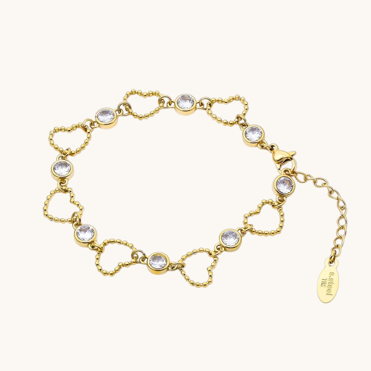 Tessa Vera 18K gold PVD stainless steel bracelet featuring open beaded heart links and sparkling clear CZ stones.